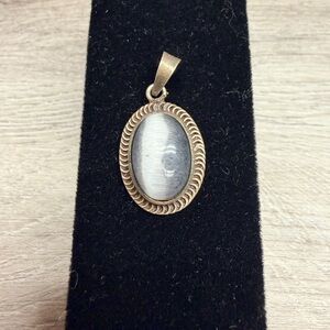 Elegant Gold Tone Pendant with White Stone